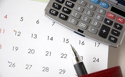 Calendar and calculator on a desk