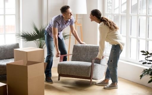 Couple moving furniture