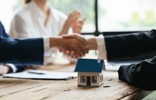 Landlord shakes hands with tenant after receiving a 60-day non-renewal notice. 