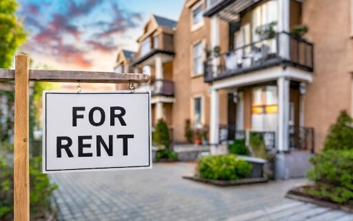 Rental property with 'For Rent' sign out front.