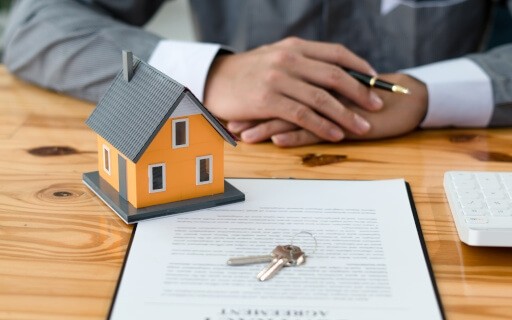 Tenant signs a renter insurance policy document. 