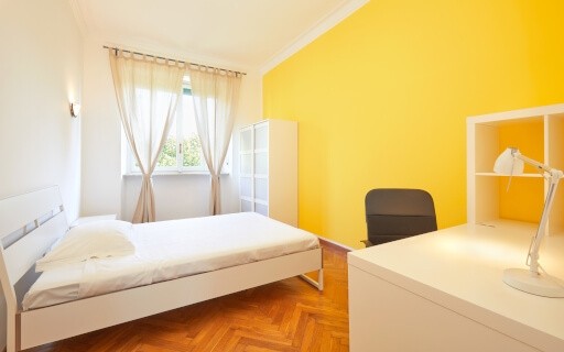 Room for rent with basic furniture.