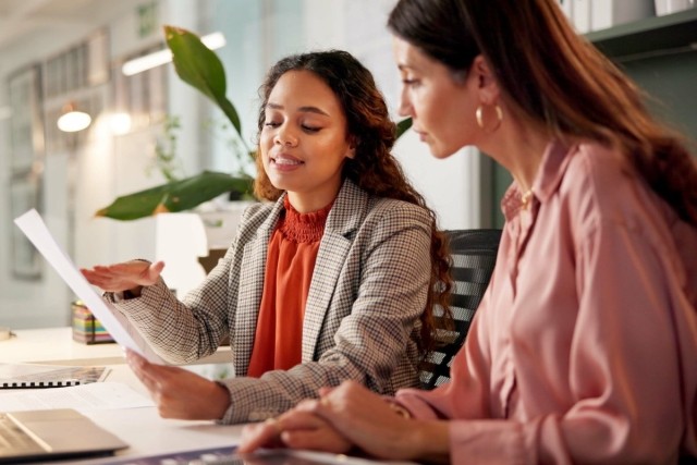 A landlord explaining the lease agreement to a renter