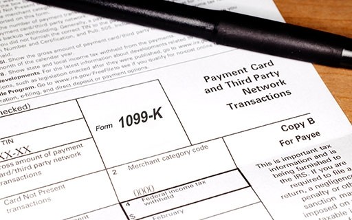 Pen on top of 1099-K tax form.