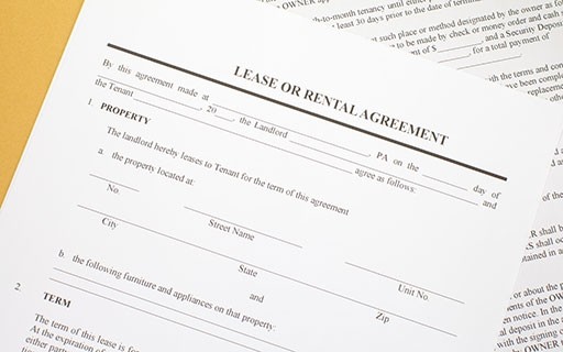 An example lease agreement sitting on a table.