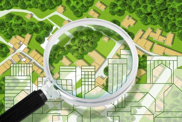 A map of a neighborhood with a magnifying glass sitting on top
