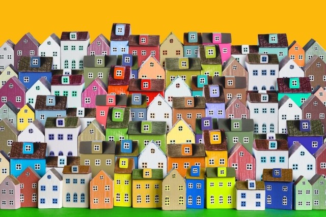 A colorful graphic of a small grouping of little homes