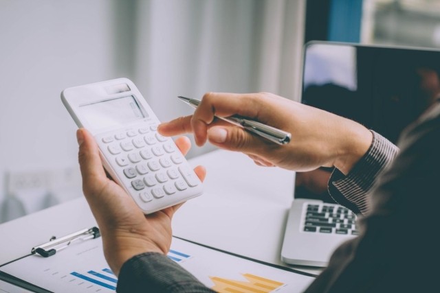 A person using a calculator