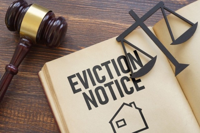 Eviction law book and the scales of justice