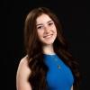 A professional headshot image of Emma Robinson.