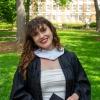Chloe Savan smiling in graduation pictures.